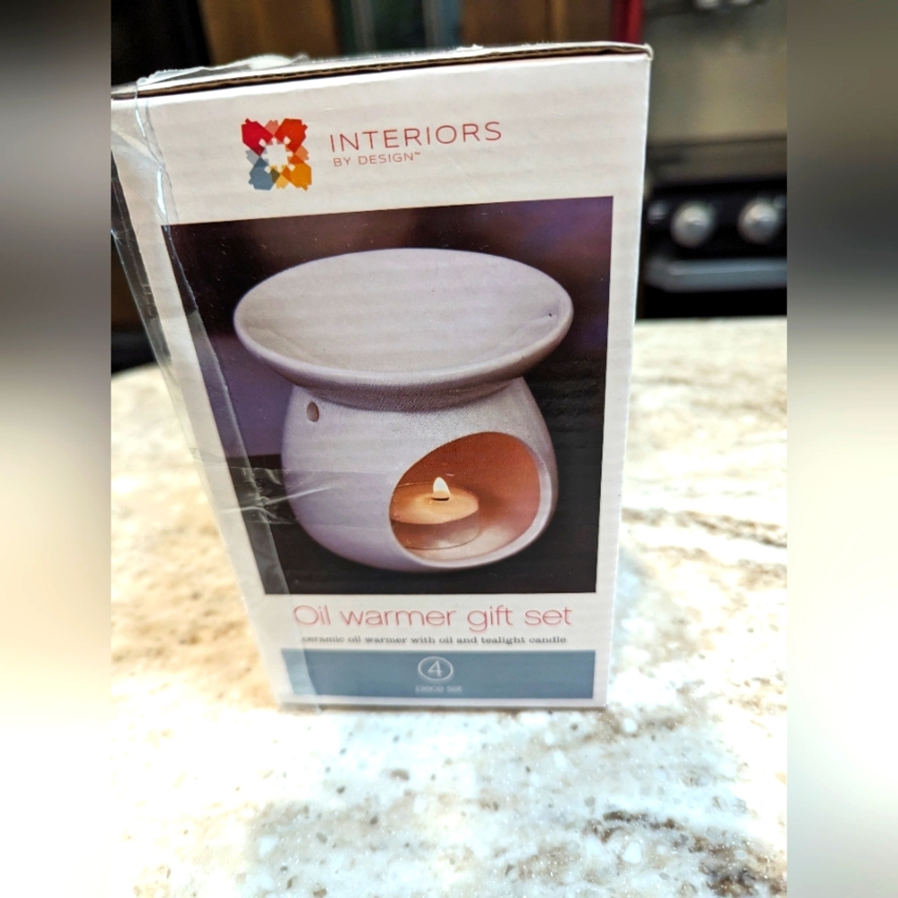 - Interiors by Design ceramic oil warmer Gift set. 4 pieces. Unopened.